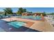Community pool area featuring a hot tub, swimming pool, lounge chairs, and shaded seating areas at 499 Eagle Vista Dr, Henderson, NV 89012