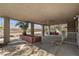 An outdoor patio with a palm tree and a metal white fence at 5101 Churchill Ave, Las Vegas, NV 89107