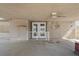 An outdoor patio with a metal white fence and a white door at 5101 Churchill Ave, Las Vegas, NV 89107