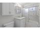 A bathroom with patterned wallpaper, shower and vanity at 5101 Churchill Ave, Las Vegas, NV 89107