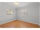 Simple bedroom featuring wood-look floors and natural lighting at 5101 Churchill Ave, Las Vegas, NV 89107