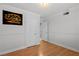 Cozy bedroom featuring wood-look floors and access to other rooms at 5101 Churchill Ave, Las Vegas, NV 89107