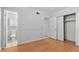 Bright bedroom featuring wood flooring, neutral walls, and ample closet space, creating a cozy atmosphere at 5101 Churchill Ave, Las Vegas, NV 89107