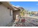 Street view of home with brick-lined planting beds, brick walkway, and mature tree at 5101 Churchill Ave, Las Vegas, NV 89107