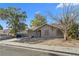 Front exterior of a single-story home with a barren yard at 5101 Churchill Ave, Las Vegas, NV 89107