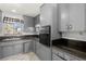 Functional kitchen featuring gray cabinets and granite countertops, ready for your culinary creations at 5101 Churchill Ave, Las Vegas, NV 89107