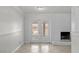 Well-lit living area featuring brick fireplace and sliding glass door at 5101 Churchill Ave, Las Vegas, NV 89107