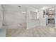 Open living room with tile floors seamlessly flows into the kitchen for a modern, connected feel at 5101 Churchill Ave, Las Vegas, NV 89107