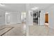 Open-concept living area with tile flooring and neutral paint colors at 5101 Churchill Ave, Las Vegas, NV 89107