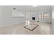 Bright living area with fireplace, tile floors, and sliding doors to patio at 5101 Churchill Ave, Las Vegas, NV 89107
