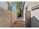 Side yard featuring a walkway and block wall at 5101 Churchill Ave, Las Vegas, NV 89107