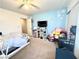 Bright bedroom with a blue accent wall, carpet flooring, and plenty of decor at 529 Regal Robin Way, North Las Vegas, NV 89084