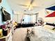 Bright bedroom featuring a ceiling fan, carpet flooring and a view of the backyard at 529 Regal Robin Way, North Las Vegas, NV 89084