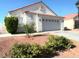 Charming single-story home with a tile roof, two car garage and desert landscaping at 529 Regal Robin Way, North Las Vegas, NV 89084