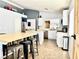 Open-concept kitchen featuring modern appliances, ample counter space, and breakfast bar at 529 Regal Robin Way, North Las Vegas, NV 89084