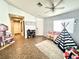 Bright living area featuring tile floors and a playful teepee tent at 529 Regal Robin Way, North Las Vegas, NV 89084