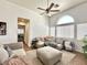 Bright living room featuring vaulted ceilings, large windows, and neutral decor at 529 Regal Robin Way, North Las Vegas, NV 89084