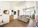 Open-concept living room with tile floors, a ceiling fan, and comfortable sofa at 529 Regal Robin Way, North Las Vegas, NV 89084