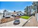 Spacious backyard featuring artificial turf, a playground set, trampoline, and a parked RV at 5876 Tippin Dr, Las Vegas, NV 89130