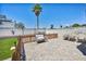 Paver patio featuring a porch swing and an outdoor seating area with partial grass yard at 5876 Tippin Dr, Las Vegas, NV 89130