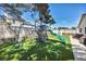 Backyard showcasing a playset on artificial grass, perfect for outdoor activities at 5876 Tippin Dr, Las Vegas, NV 89130