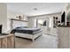 Spacious bedroom featuring a large window and neutral color palette at 5876 Tippin Dr, Las Vegas, NV 89130