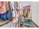 Walk-in closet featuring organized clothes and storage containers at 5876 Tippin Dr, Las Vegas, NV 89130