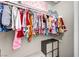 Well-organized closet with hanging clothes and storage cube at 5876 Tippin Dr, Las Vegas, NV 89130
