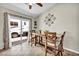Bright dining area with a modern table set and sliding glass doors for backyard access at 5876 Tippin Dr, Las Vegas, NV 89130