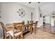 Bright dining room with a wooden table and chairs with backyard view at 5876 Tippin Dr, Las Vegas, NV 89130