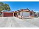 Charming single-story home featuring solar panels, a spacious driveway, and gated side yard at 5876 Tippin Dr, Las Vegas, NV 89130