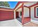 Inviting covered front porch leads to the front door of the quaint single-story house at 5876 Tippin Dr, Las Vegas, NV 89130