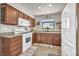 Efficient kitchen featuring granite countertops, white appliances, and ample cabinet space at 5876 Tippin Dr, Las Vegas, NV 89130