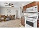 Spacious kitchen featuring stainless steel oven and a dining area with tile flooring at 5876 Tippin Dr, Las Vegas, NV 89130