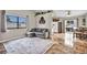 Comfortable living room featuring tile floors, a window with natural light, and view to dining area at 5876 Tippin Dr, Las Vegas, NV 89130