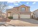 Charming two-story home featuring a three-car garage and well-maintained landscaping at 59 Desert Dawn Ln, Henderson, NV 89074