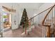 Welcoming foyer with a view of the staircase and a decorated Christmas tree at 59 Desert Dawn Ln, Henderson, NV 89074