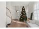 Bright and airy living room featuring a festive Christmas tree and modern furnishings at 59 Desert Dawn Ln, Henderson, NV 89074