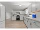 Bright kitchen features white cabinets, stainless steel appliances, and new countertops at 6229 Cromwell Ave, Las Vegas, NV 89107