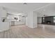 Bright open-concept living room flows to the kitchen with updated appliances and sleek countertops at 6229 Cromwell Ave, Las Vegas, NV 89107