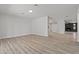 Open concept living room with fireplace and wood-look flooring at 6229 Cromwell Ave, Las Vegas, NV 89107