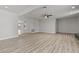 Spacious open-plan living area with light wood floors throughout at 6229 Cromwell Ave, Las Vegas, NV 89107
