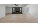 Charming living room showcases a brick fireplace, abundant lighting, and modern finishes at 6229 Cromwell Ave, Las Vegas, NV 89107