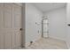 Utility room features laminated floors, neutral colored walls, a door to the exterior, and a water heater at 6229 Cromwell Ave, Las Vegas, NV 89107