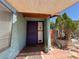 Inviting home entrance with a purple door, covered patio, and easy-to-read address numbers at 6700 Oak Valley Dr, Las Vegas, NV 89103