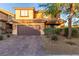 Charming two-story home features a well-maintained front yard and a two-car garage at 6954 Jacksboro Ct, North Las Vegas, NV 89084