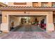 Spacious garage with an open door and paver driveway at 6954 Jacksboro Ct, North Las Vegas, NV 89084