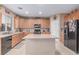 Bright kitchen with central island and stylish appliances at 6954 Jacksboro Ct, North Las Vegas, NV 89084