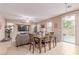 Spacious living room with dining area, fan and access to outdoor space at 6954 Jacksboro Ct, North Las Vegas, NV 89084