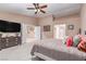 Bright and airy main bedroom with a TV, double doors, and ensuite bathroom access at 6954 Jacksboro Ct, North Las Vegas, NV 89084